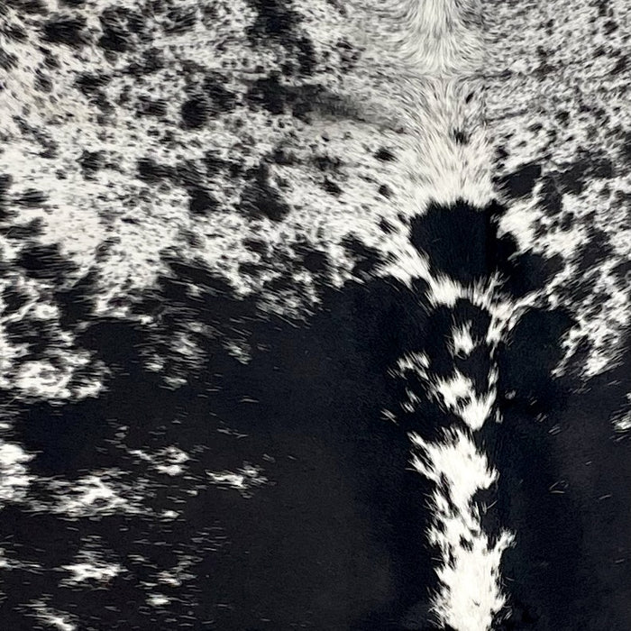 Closeup of this extra-large Speckled Brazilian Cowhide, showing white with black speckles and large and small, black spots (BRSP3444)