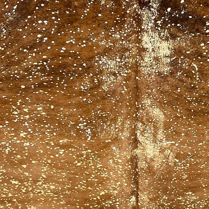Closeup of this Large Colombian Brindle Cowhide, showing brown with black, brindle markings, and a metallic, gold acid wash COAW518)