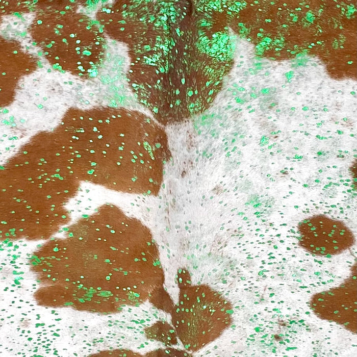 Closeup of this Large Colombian Cowhide, showing white with brown spots, and a metallic, green acid wash COAW521)
