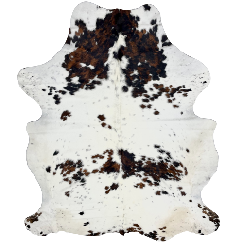 Large Colombian Tricolor Cowhide: white with faint speckles, and it has spots that are a mix of black and brown - 7'7" x 5'8" (COTR621)