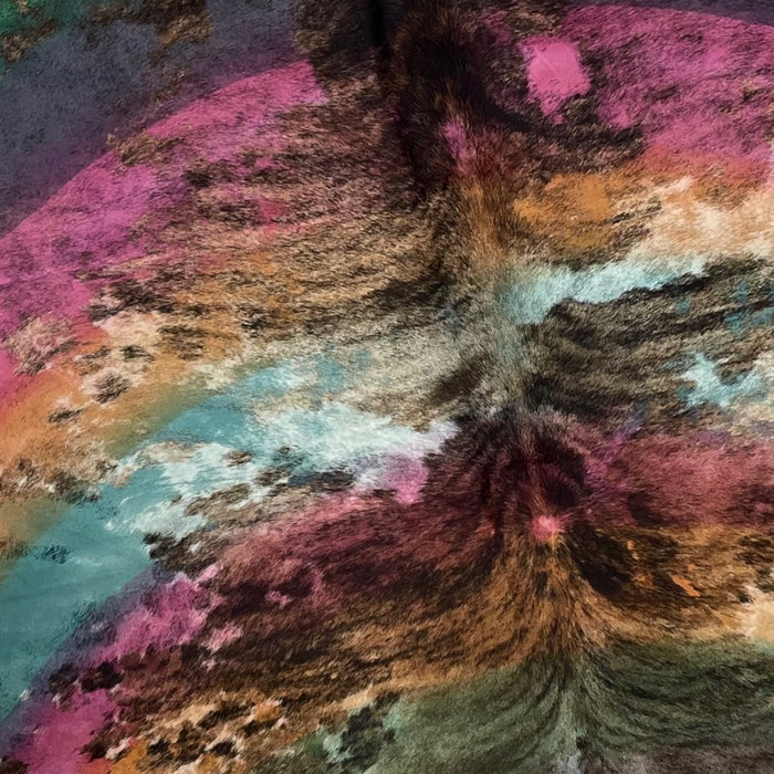 Closeup of this XL, Brazilian Cowhide, showing black and brown, brindle, and a rainbow acid wash that has shades of green, pink, orange, and blue (BRAW403)