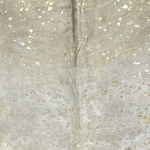 Closeup of this Off-White, Brazilian Cowhide, showing a Gold, metallic Acid Wash (BRAW440)
