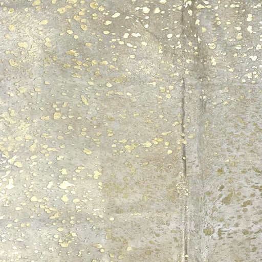 Closeup of this Off-White, Brazilian Cowhide, showing a gold, metallic acid wash (BRAW441)
