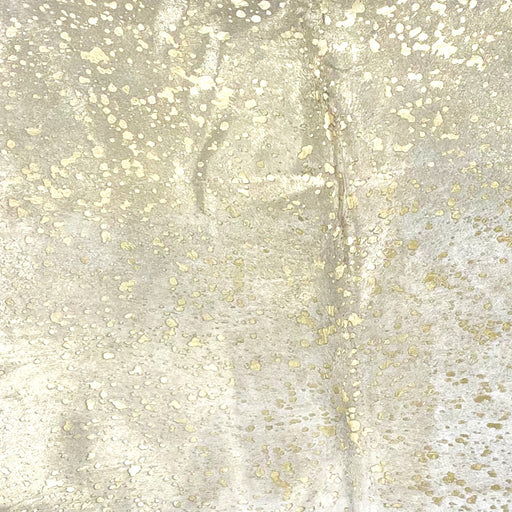 Closeup of this Large, White, Brazilian Cow hide, showing a gold, metallic acid wash (BRAW445)