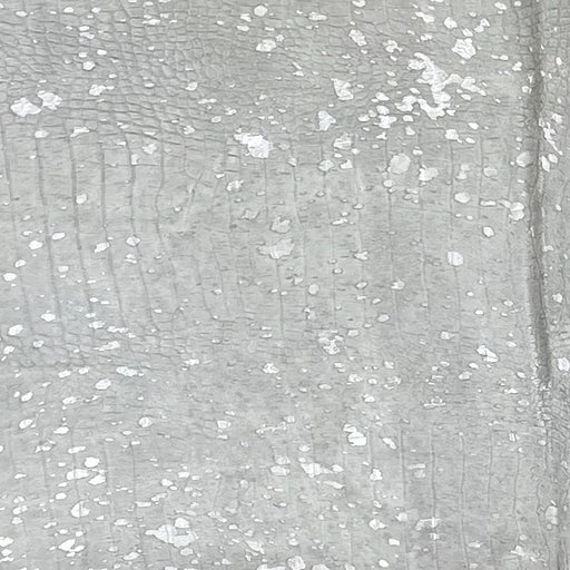 Closeup of this Large Off-White Brazilian Cowhide, showing an embossed Croc Print and a Silver metallic Acid Wash (BRAW454)