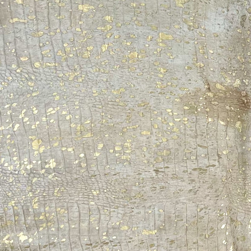 Closeup of this Large Light Beige Brazilian Cowhide, showing an embossed Croc Print and a Gold metallic Acid Wash (BRAW455)