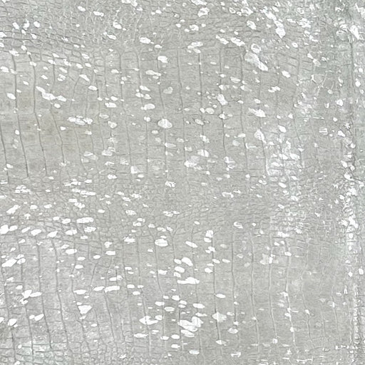 Closeup of this Large Off-White Brazilian Cowhide, showing an embossed Croc Print and a Silver metallic Acid Wash - 7'9" x 5'11" (BRAW456)