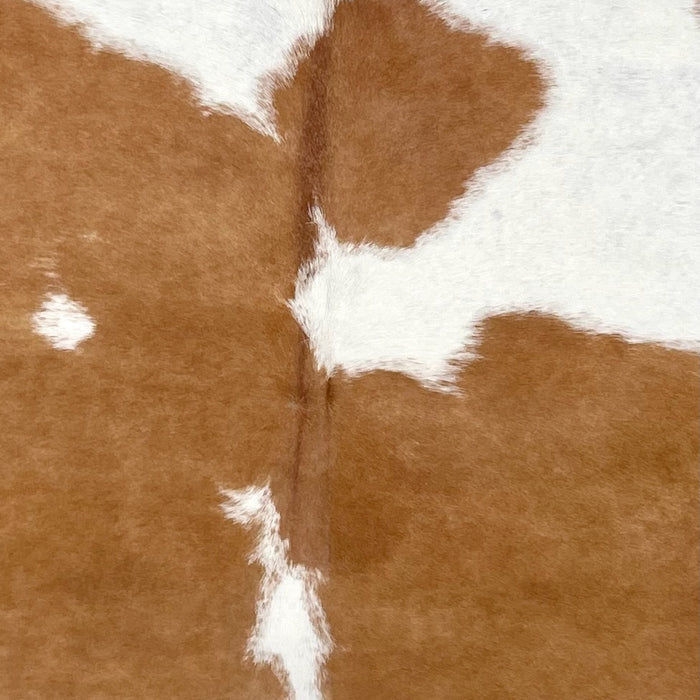 Closeup of this Brazilian Cowhide, showing white with large, brown spots (BRBNW363)
