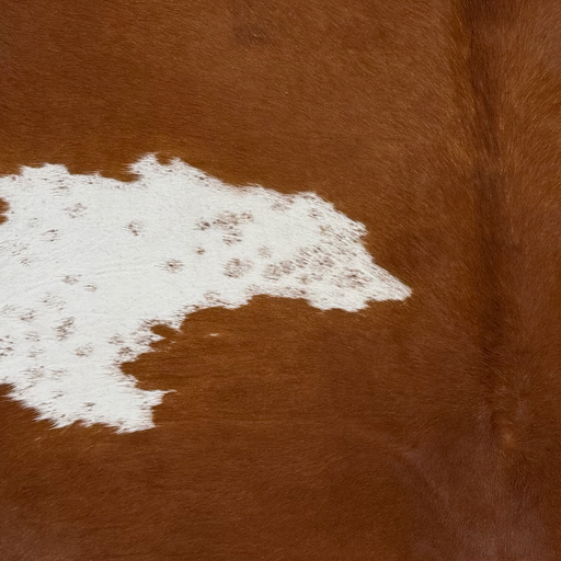 Closeup of t his Brazilian Cowhide, showing brown with white spots that have brown speckles (BRBNW395)