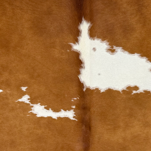 Closeup of this Brazilian Cowhide, showing brown with white spots   (BRBNW402)