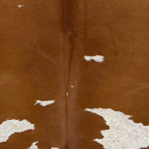 Closeup of this Brazilian Cowhide, showing brown with white spots that have brown speckles (BRBNW408)