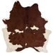 Dark Reddish Brown and Off-White Brazilian Cowhide: has long hair that is dark, reddish brown with off-white spots and off-white on the belly and hind shanks - 6'11" x 5'9" (BRBNW417)