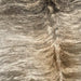 Closeup of this Brazilian, Brindle Cowhide, showing off-white and brown, with taupe and black, brindle markings (BRBR1107)