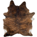 Brown and Black Brazilian Brindle Cowhide, 1 brand mark:  brown with black, brindle markings, and it has one brand mark on the left side of the butt - 7'3" x 5'7" (BRBR1117)