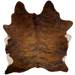 Reddish Brown and Black Brazilian Brindle Cowhide: has long hair that is reddish brown, with black, brindle markings, and it has a splash of off-white on the belly - 6'11" x 5'9" (BRBR1138)