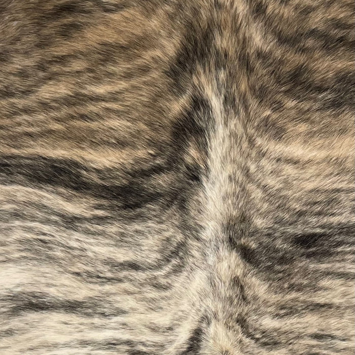 Closeup of this Brazilian Light Brindle Cowhide, showing ivory and brown with black, brindle markings  (BRBR1336)