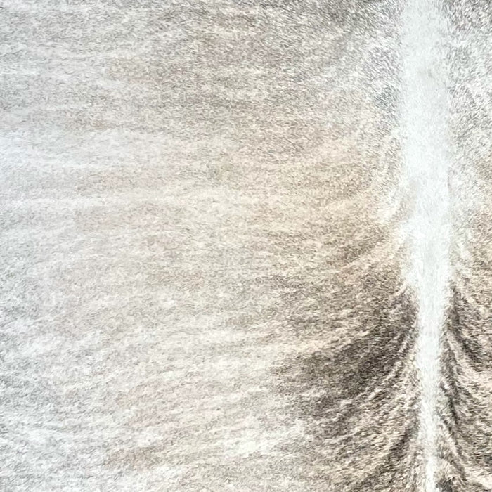 Closeup of this Brazilian Light Brindle Cowhide, showing white and light tan with black and dark gray, brindle markings  (BRBR1470)