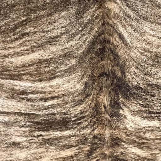 Closeup of this Brazilian Brindle Cowhide, showing off-white and brown, with black and dark brown, brindle markings (BRBR1494)