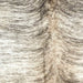 Closeup of this Brazilian Brindle Cowhide, showing off-white and light brown with a black and brown, brindle pattern  (BRBR1556)