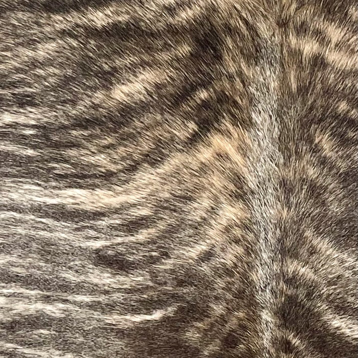 Closeup of this Large Brazilian Brindle Cowhide, showing ivory and brown with black, brindle markings (BRBR1574)