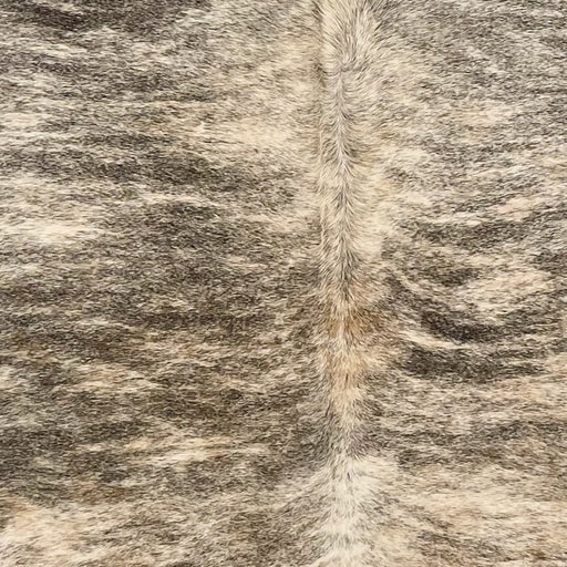 Closeup of this Brazilian Brindle Cowhide, showing ivory and light beige with black, brindle markings (BRBR1591)