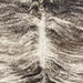 Closeup of this Brazilian Brindle Cowhide, showing white with dark brown and blackish brown, brindle markings  (BRBR1633)