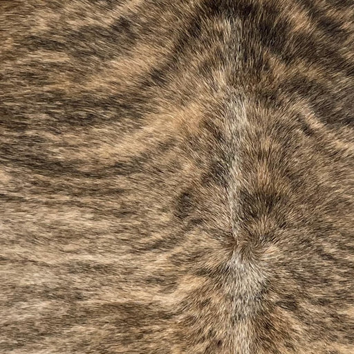 Closeup of this Large Brazilian Brindle Cowhide, showing light tan and brown, with black, brindle markings (BRB1658)