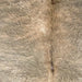 Closeup of this Brazilian Brindle Cowhide, showing long hair that is ivory and beige with gray, brindle markings  (BRBR1689)