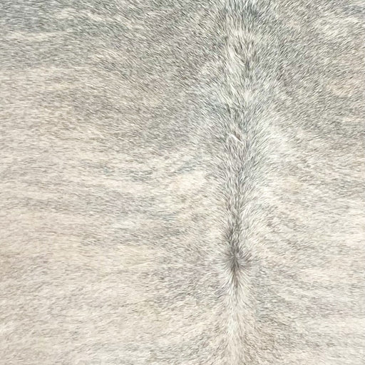 Closeup of t his XXL Brazilian Brindle Cowhide, showing a mix of light beige and white with gray, brindle markings  (BRBR1695)