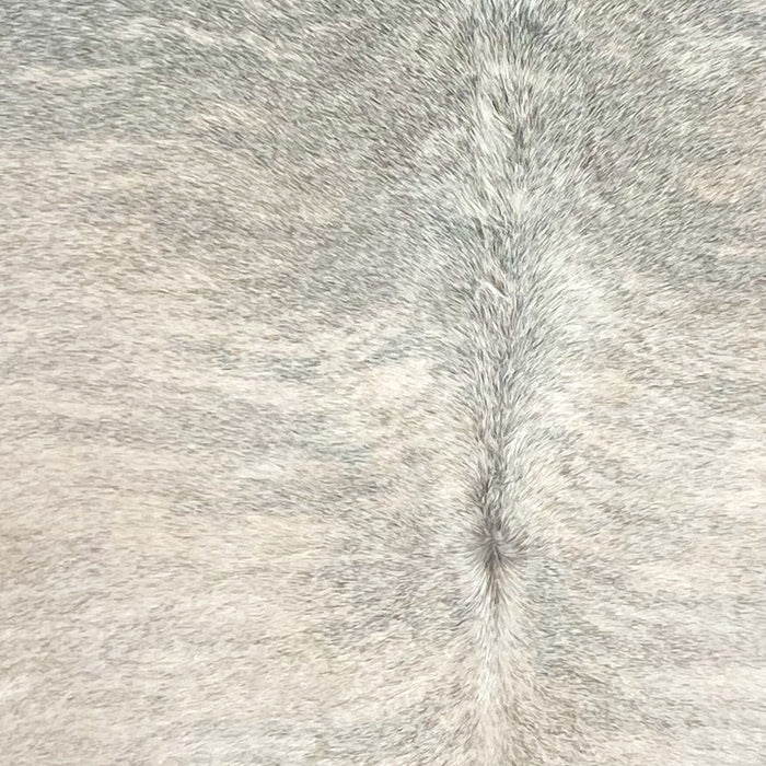 Closeup of t his XXL Brazilian Brindle Cowhide, showing a mix of light beige and white with gray, brindle markings  (BRBR1695)