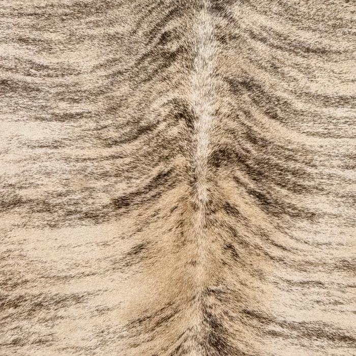 Closeup of this Large Brazilian Brindle Cowhide, showing light tan and light brown with black, brindle markings  (BRBR1762)