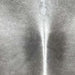 closeup of this Large Brazilian Cowhide, showing light gray, with darker gray down both sides of a white spine (BRGR289)
