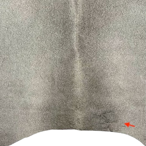 closeup of this Two Tone Gray Brazilian Cowhide, showing one brand mark on the right side of the butt (BRGR293)