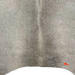 closeup of this Two Tone Gray Brazilian Cowhide, showing one brand mark on the right side of the butt (BRGR293)