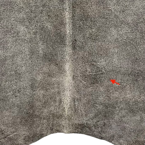 closeup of this Large Gray Brazilian Cowhide, showing one brand mark on the right side of the back (BRGR295)