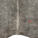 closeup of this Large Gray Brazilian Cowhide, showing one brand mark on the right side of the back (BRGR295)