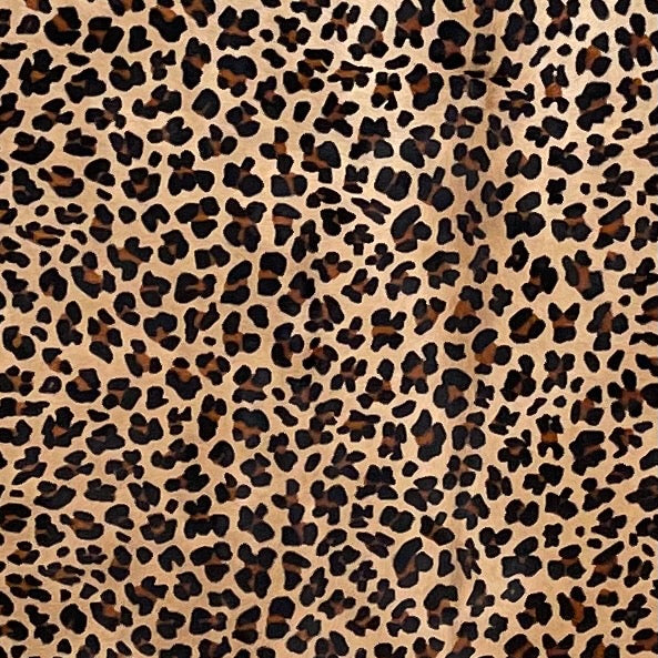 Closeup of this Light Brown Brazilian Cowhide, showing a stenciled, brown and black, leopard print (BRLP123)