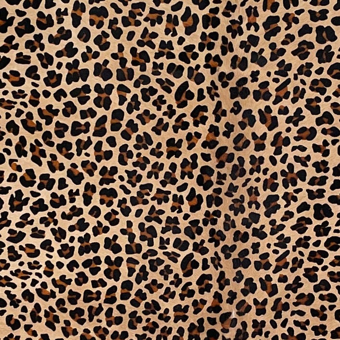 Closeup of this Light Brown Brazilian Cowhide, showing a stenciled, brown and black, leopard print (BRLP124)