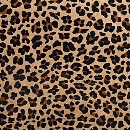 closeup of this Light Brown Brazilian Cowhide, showing a stenciled, brown and black, leopard print - 6'10" x 5'11" (BRLP128)