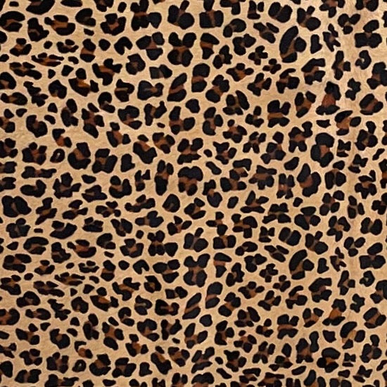 Closeup of this Light Brown Brazilian Cowhide, showing a stenciled, brown and black, leopard print - 7'2" x 6'1" (BRLP129)