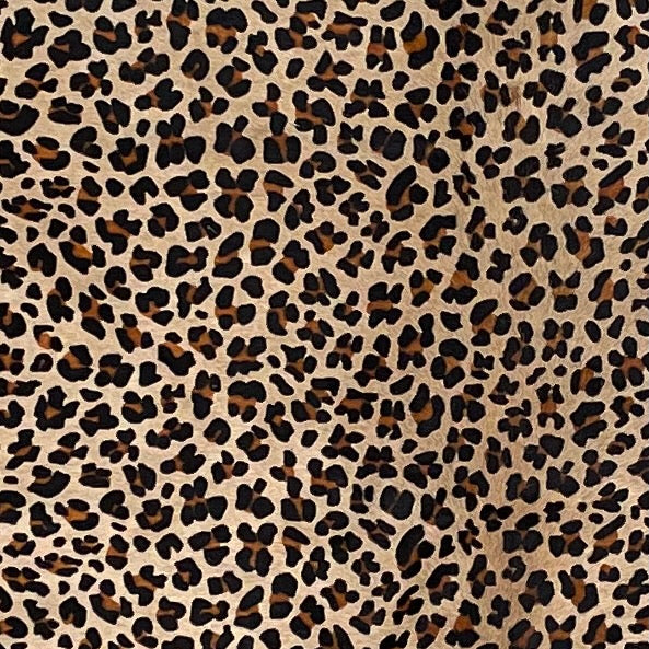 Closeup of this Large Light Beige Brazilian Cowhide, showing a stenciled, brown and black, leopard print (BRLP130)