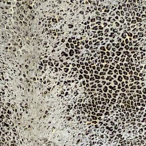 Closeup of this Large, Off-White, Brazilian Cowhide showing a Distressed Leopard & Gold Metallic Acid Wash  (BRLPAW093)
