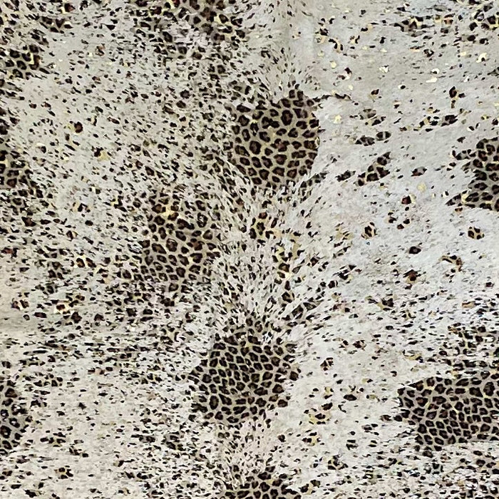 Closeup of this Large, Lt Beige, Brazilian Cowhide, showing Distressed, black and brown, Leopard print, and Gold, Metallic Acid Washes (BRLPAW102)