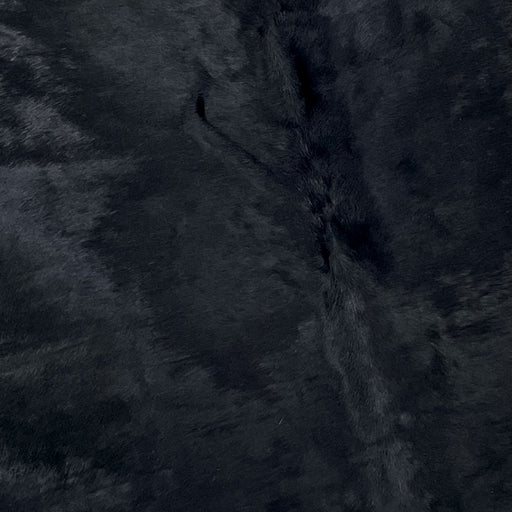 Closeup of this Large, Brazilian Cow hide that has been dyed black  (BRSLD202)