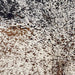 Closeup of this XL, Off-White, Brazilian Cowhide, showing a brown and black, Speckled Print  (BRSP-P004)