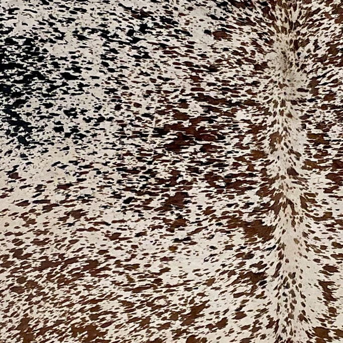Closeup of this Large, Off-White, Brazilian Cowhide, showing a brown and black, Speckled Print (BRSP-P005)