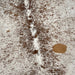 Closeup of this Large, Brown and White, Speckled, Brazilian Cowhide, showing white with brown speckles and spots, and one caramel spots on the right side of the back (BRSP1907)