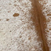 Closeup of this White and Brown, Speckled, Brazilian Cowhide, showing white with brown speckles and spots, solid brown down the spine (BRSP1951)