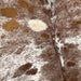 Closeup of this Large, Speckled, Brazilian Cowhide, showing white with brown speckles, spots that are different shades of brown, and one of two light tan spot on the left side  (BRSP2238)