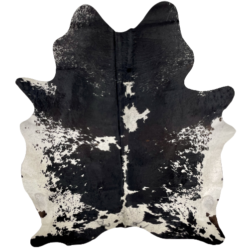 Black and White Speckled Brazilian Cowhide, 2 brand marks:  white with speckles and large and small black spots, and it has mostly black with white speckles on the shoulder, and it has two brand marks, one on each side of the butt - 7'3" x 5'5" (BRSP2262)